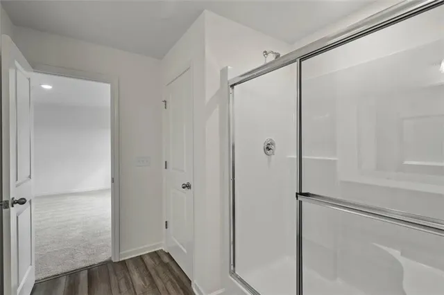 a bathroom with a glass shower door