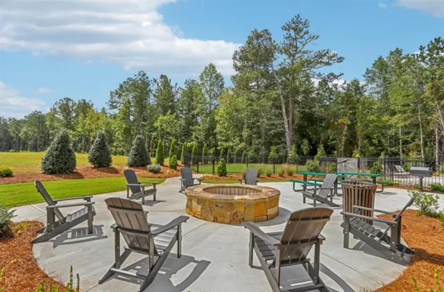 a view of a backyard with sitting area