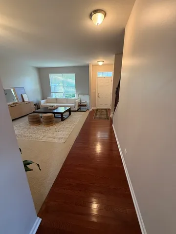 a living room with furniture rug and window