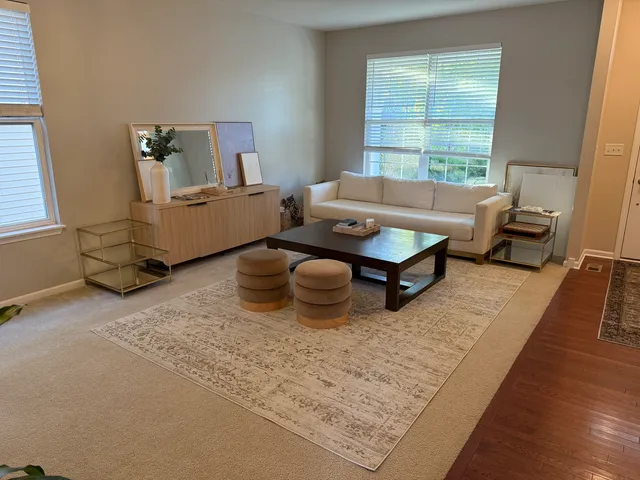 a room with pool table and windows
