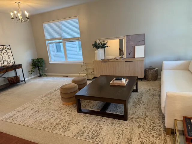 a living room with furniture and a table