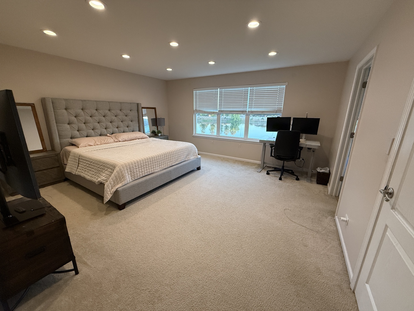 2572 Retreat Circle Lisle, IL 60532 - Photo 22 of 40 a spacious bedroom with a bed and a large window