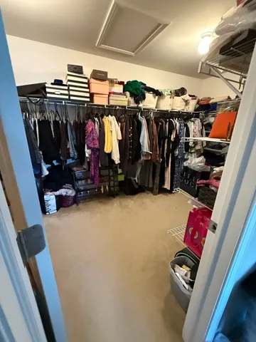 a bathroom with a double vanity sink toilet and shower