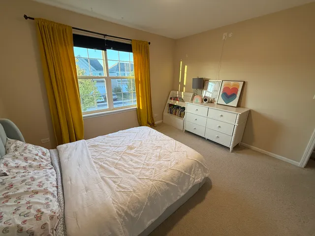 a view of a room with gym equipment and windows