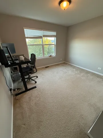 a bedroom with a bed and a table in it