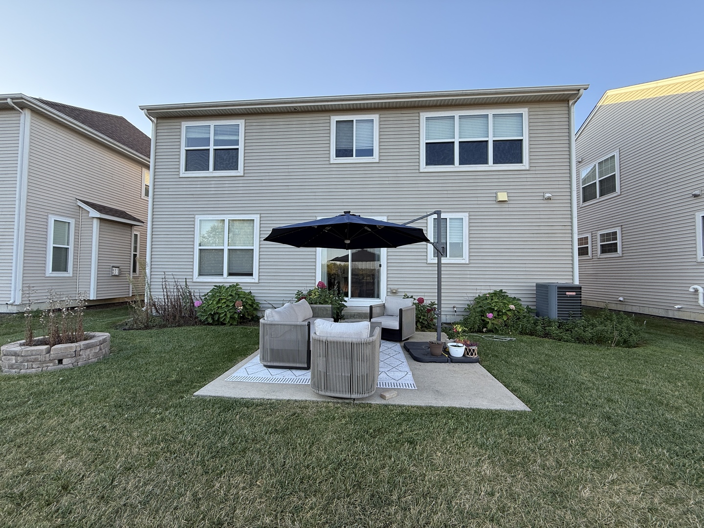 2572 Retreat Circle Lisle, IL 60532 - Photo 36 of 40 a view of a house with backyard sitting area and garden