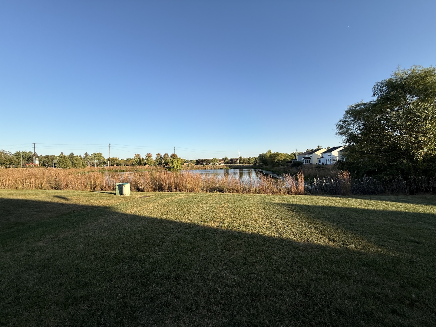 2572 Retreat Circle Lisle, IL 60532 - Photo 38 of 40 a view of a lake with houses in the back