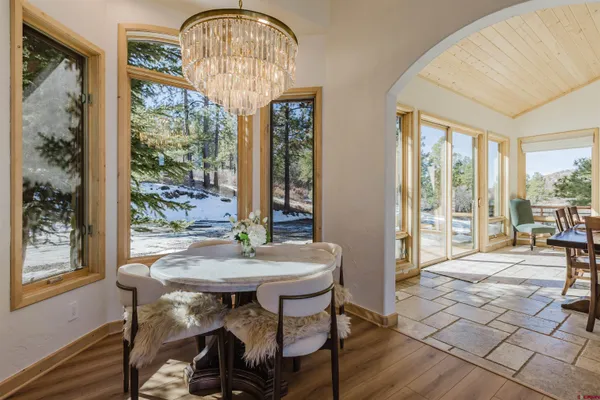 a bathroom with a granite countertop sink a mirror and a shower