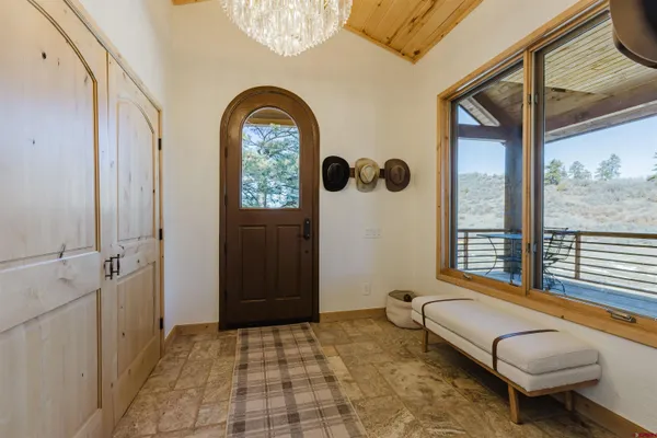 a large kitchen with stainless steel appliances granite countertop a lot of counter space and wooden floors