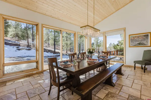 a view of a balcony with floor to ceiling window and wooden floor