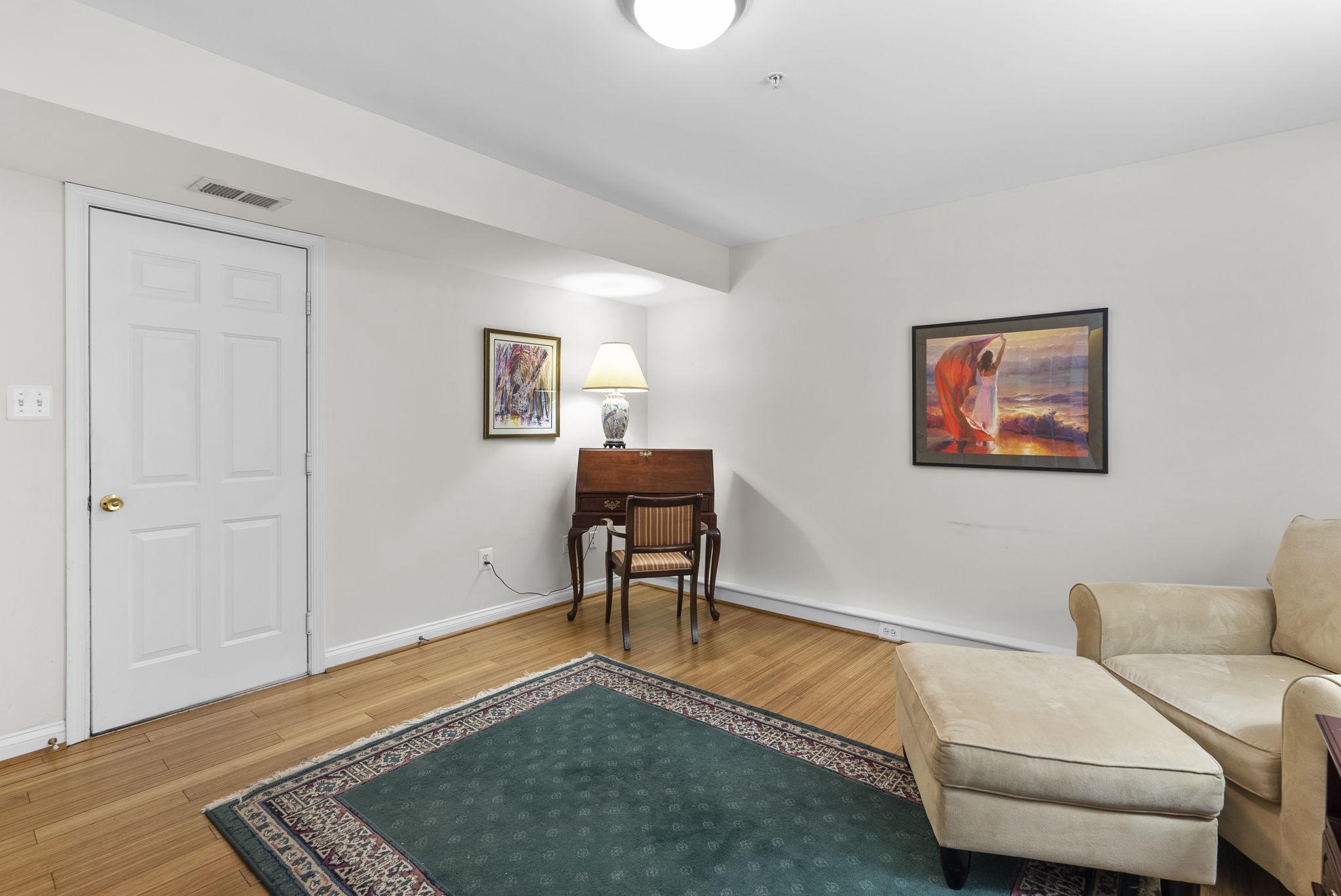 2128 Darcy Green Place Silver Spring, MD 20910 - Photo 5 of 34 Main level family room with wood floors