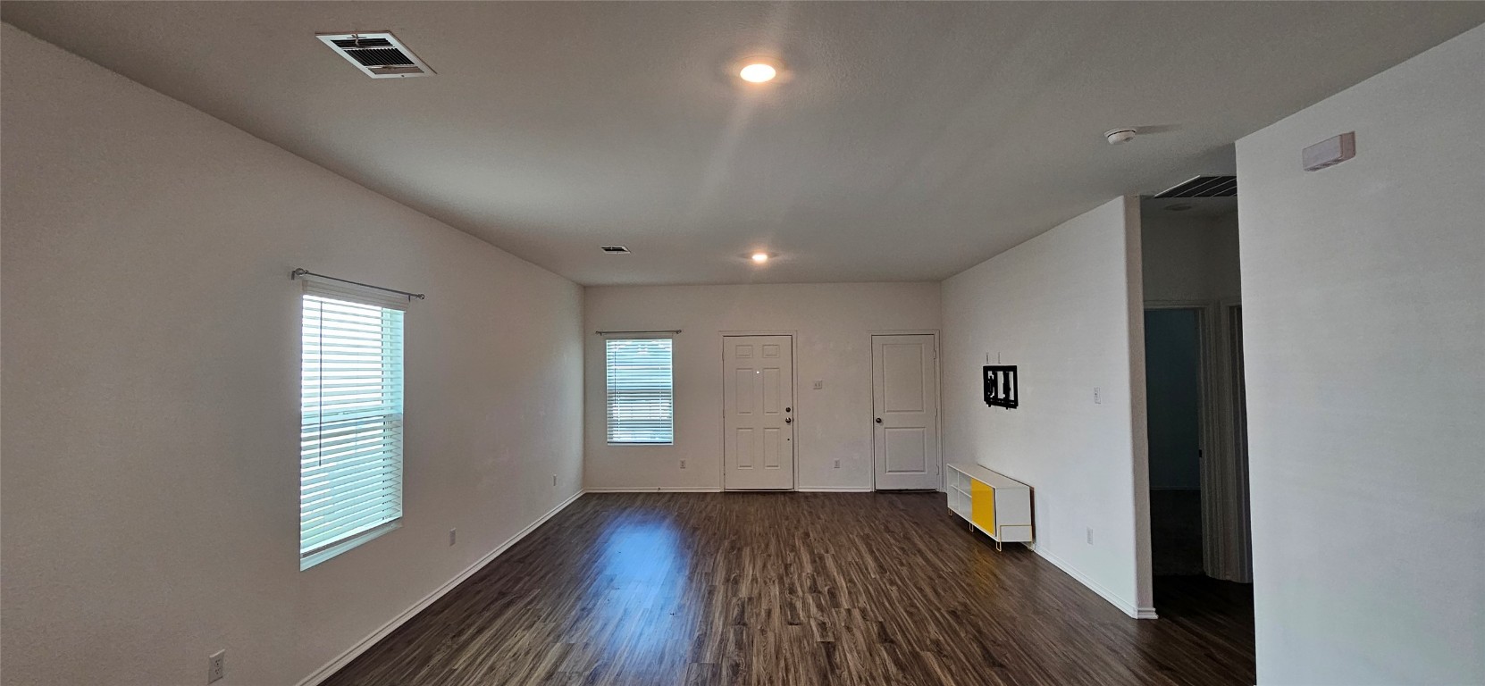 325 Geode Glen Maxwell, TX 78656 - Photo 20 of 28 a view of a livingroom with wooden floor and window