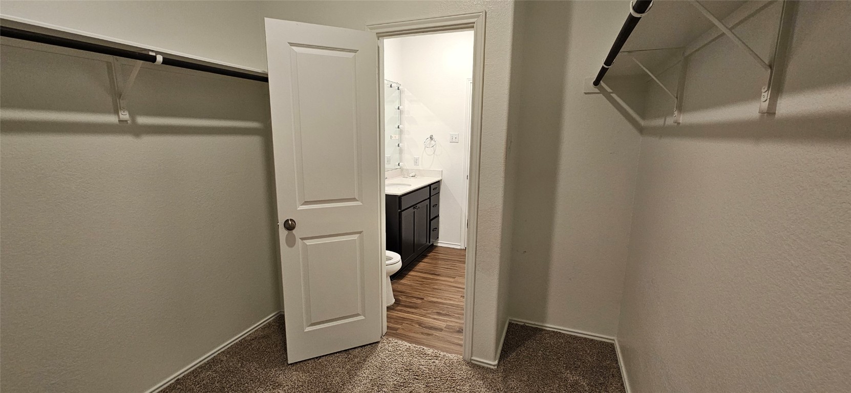 325 Geode Glen Maxwell, TX 78656 - Photo 25 of 28 Spacious closet with dark colored carpet