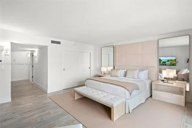 a bedroom with a bed and a couch