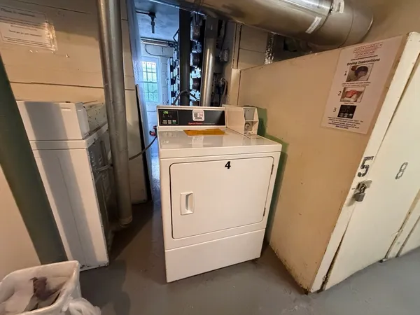 a view of storage and utility room with washer and dryer