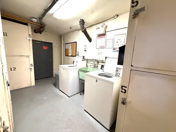a view of a storage & utility room with washer and dryer