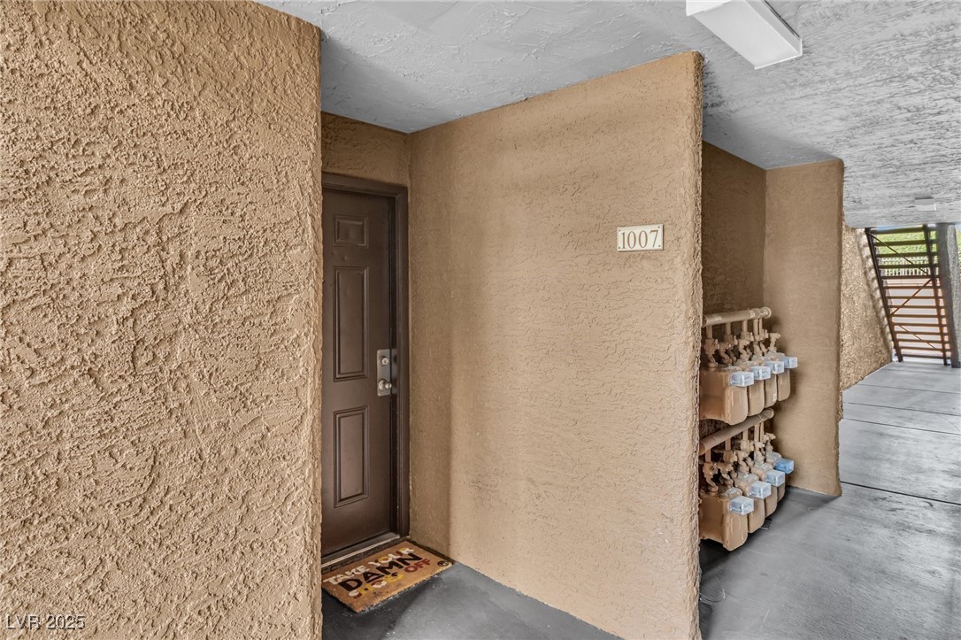 2200 South Fort Apache Road, Unit 1007 Las Vegas, NV 89117 - Photo 3 of 30 Doorway to property featuring stucco siding
