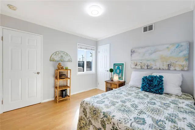 a bedroom with a bed and a cabinets