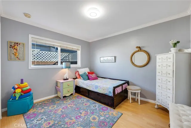 a bedroom with bed and a window