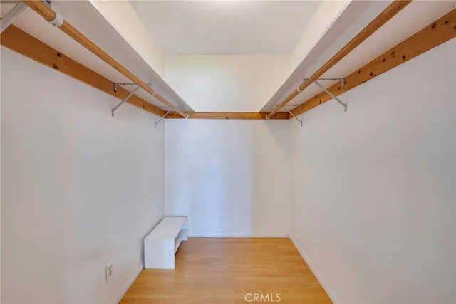 a bedroom with a large bed and a couch