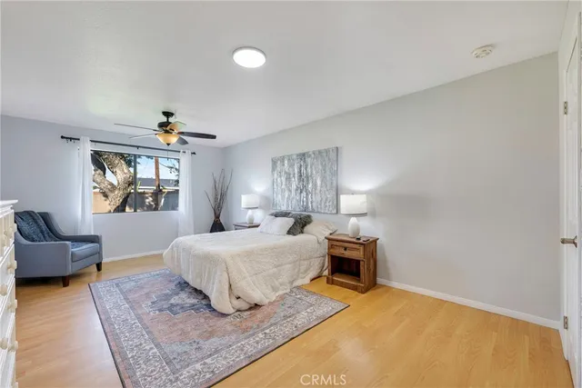 a spacious bedroom with a bed and a couch