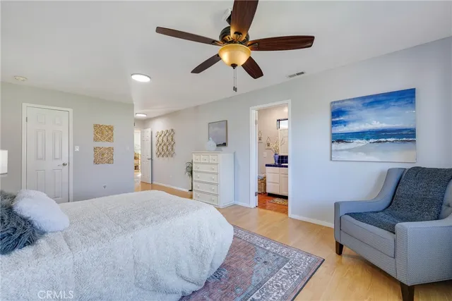 a bath room with a sink a mirror and a rug