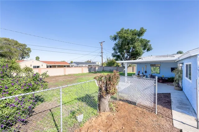 a view of a backyard with furniture