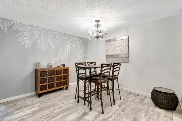 a view of a livingroom with furniture and wooden floor