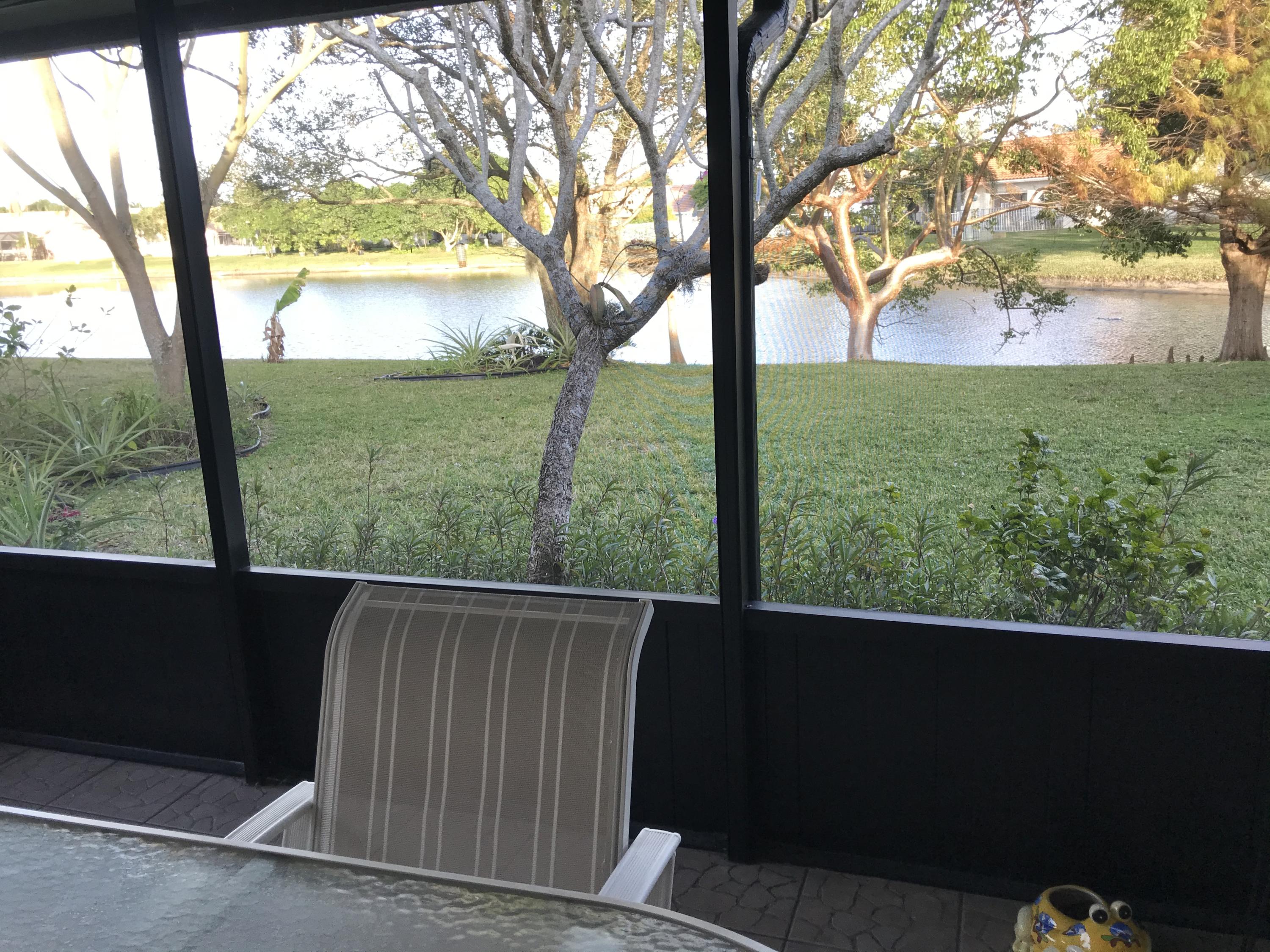 9693 El Clair Ranch Road Boynton Beach, FL 33437 - Photo 1 of 9 Patio with lake view