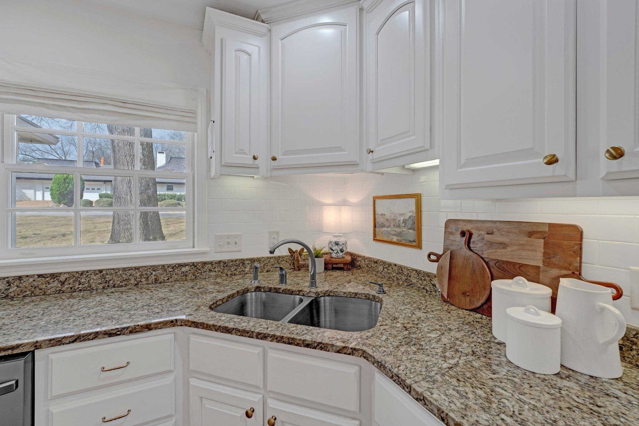 5481 Walnut Grove Road Memphis, TN 38120 - Photo 13 of 40 a kitchen with a sink and cabinets