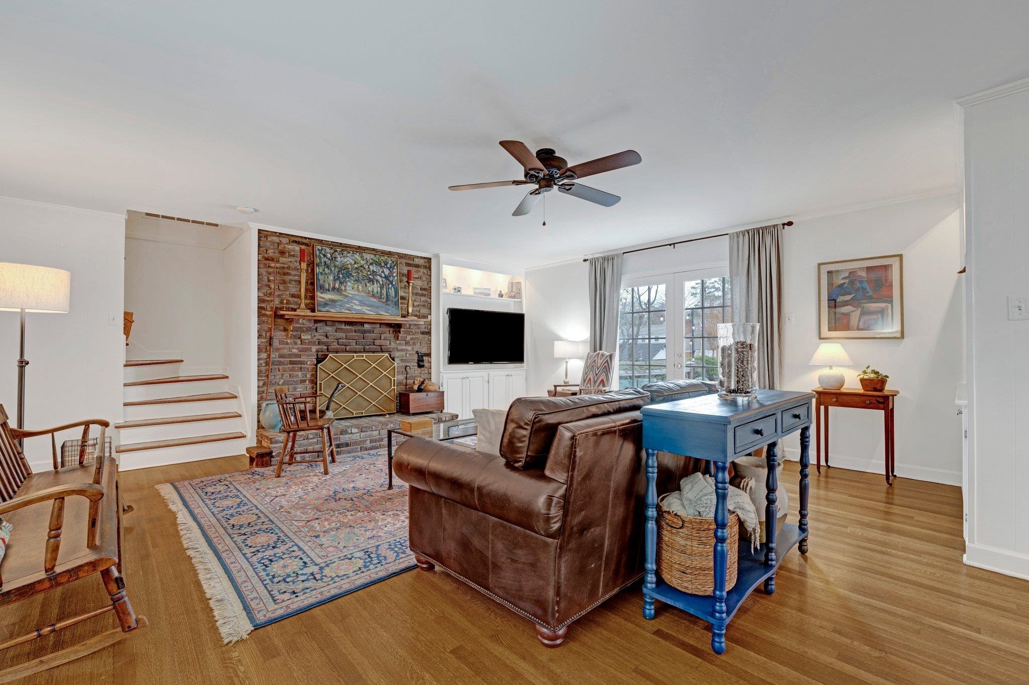 5481 Walnut Grove Road Memphis, TN 38120 - Photo 17 of 40 a living room with furniture and a flat screen tv