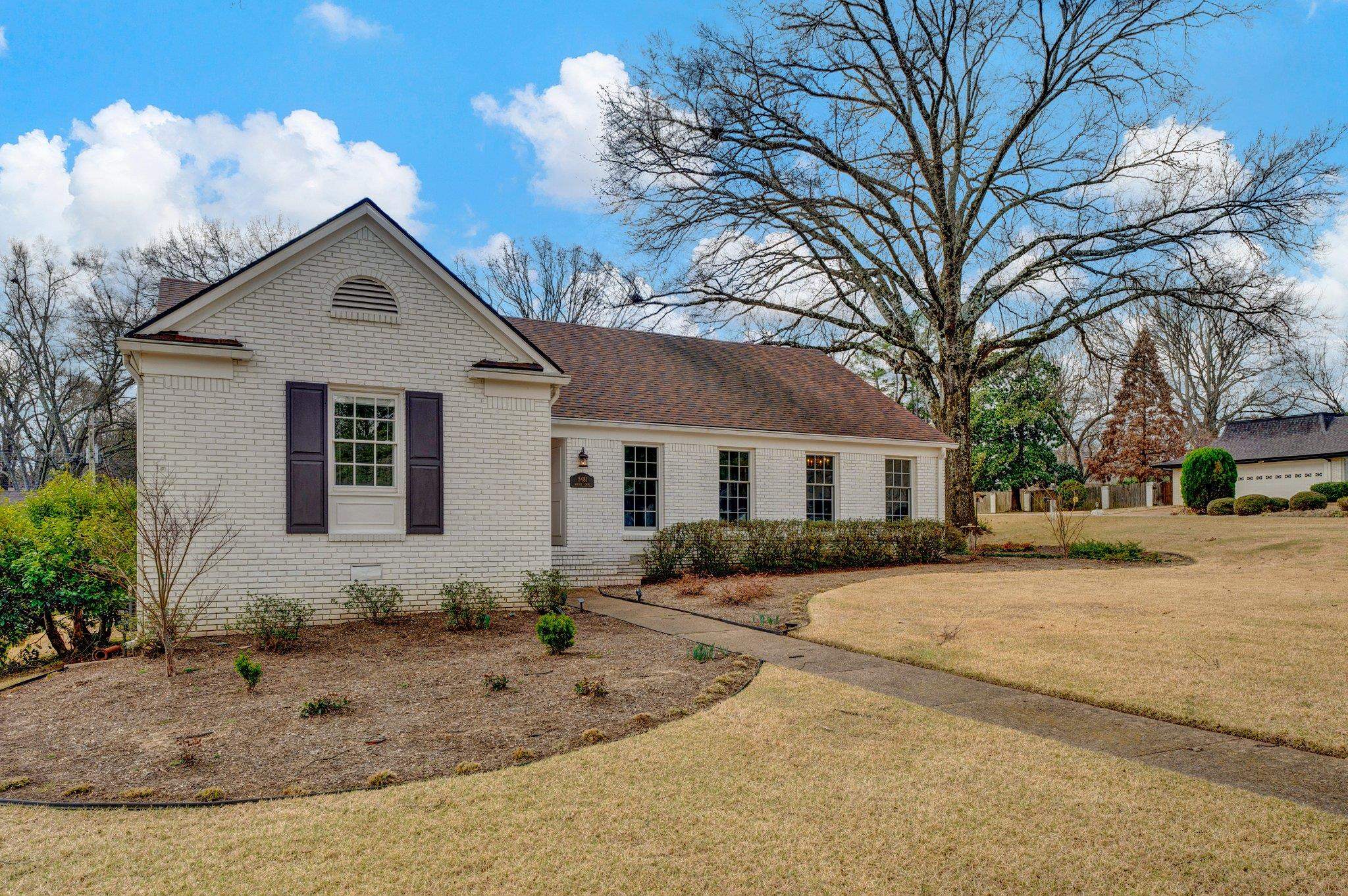 5481 Walnut Grove Road Memphis, TN 38120 - Photo 2 of 40 a view of a house with a yard