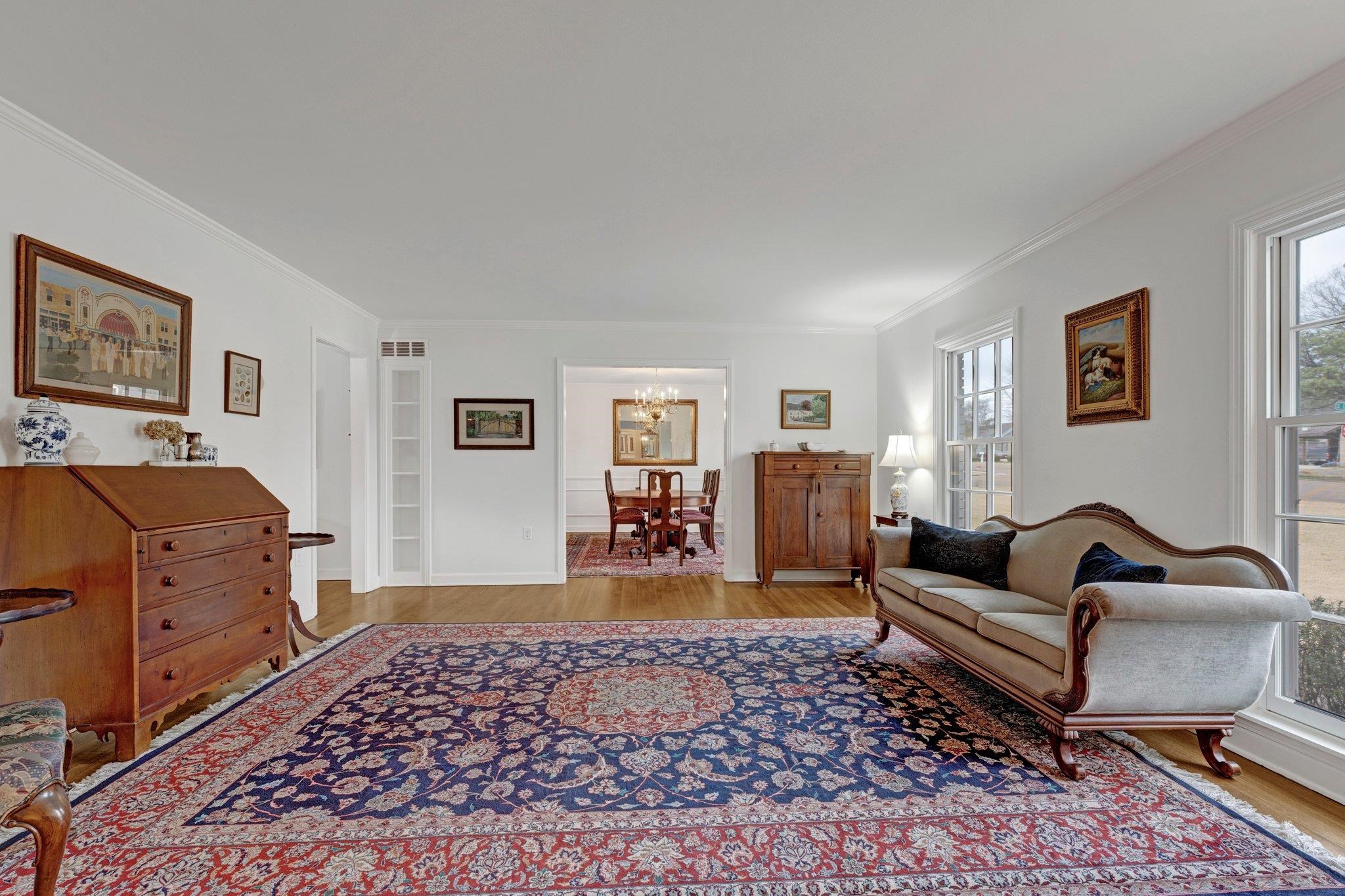 5481 Walnut Grove Road Memphis, TN 38120 - Photo 23 of 40 a living room with furniture and wooden floor