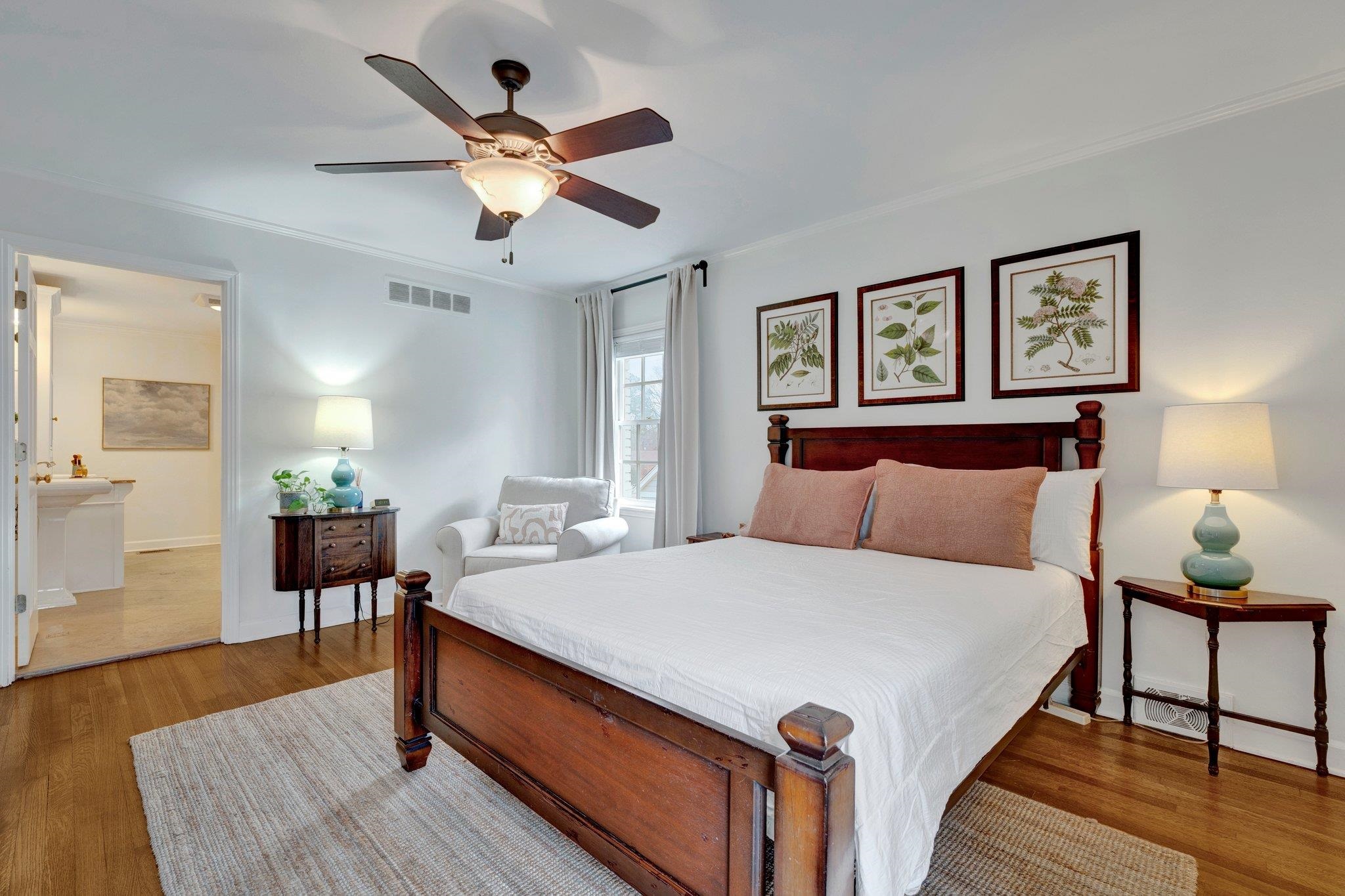 5481 Walnut Grove Road Memphis, TN 38120 - Photo 26 of 40 a bed room with a bed and a chandelier
