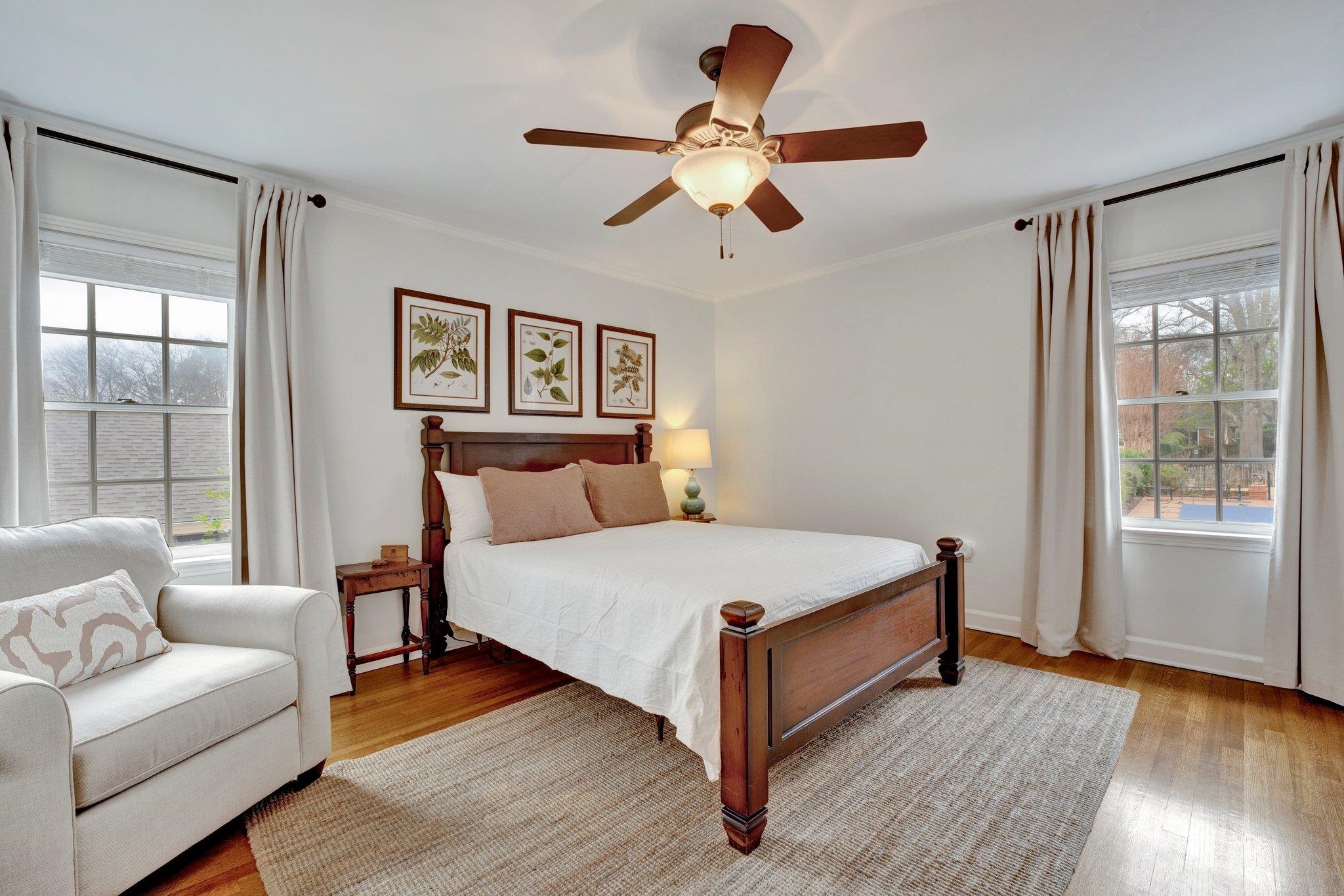 5481 Walnut Grove Road Memphis, TN 38120 - Photo 27 of 40 a bedroom with a large bed and a window