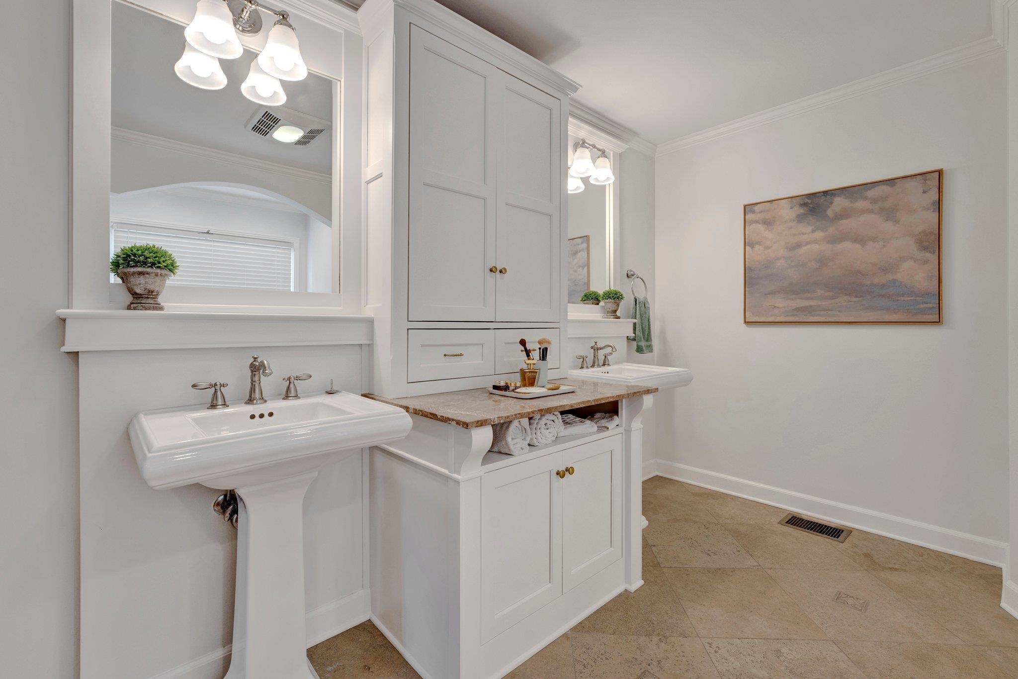 5481 Walnut Grove Road Memphis, TN 38120 - Photo 28 of 40 a bathroom with a sink and a mirror