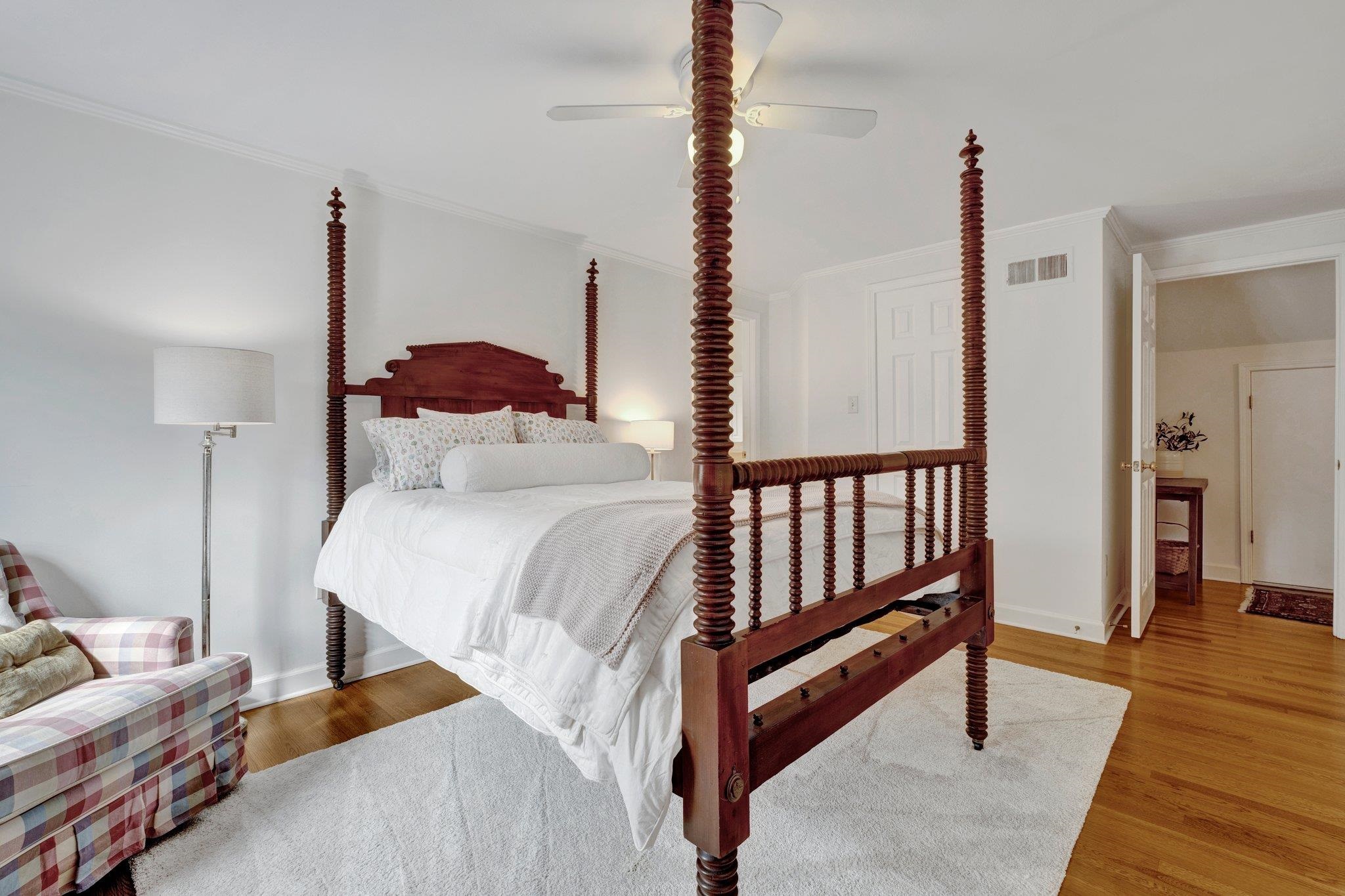 5481 Walnut Grove Road Memphis, TN 38120 - Photo 36 of 40 a bedroom with a bed and wooden floor