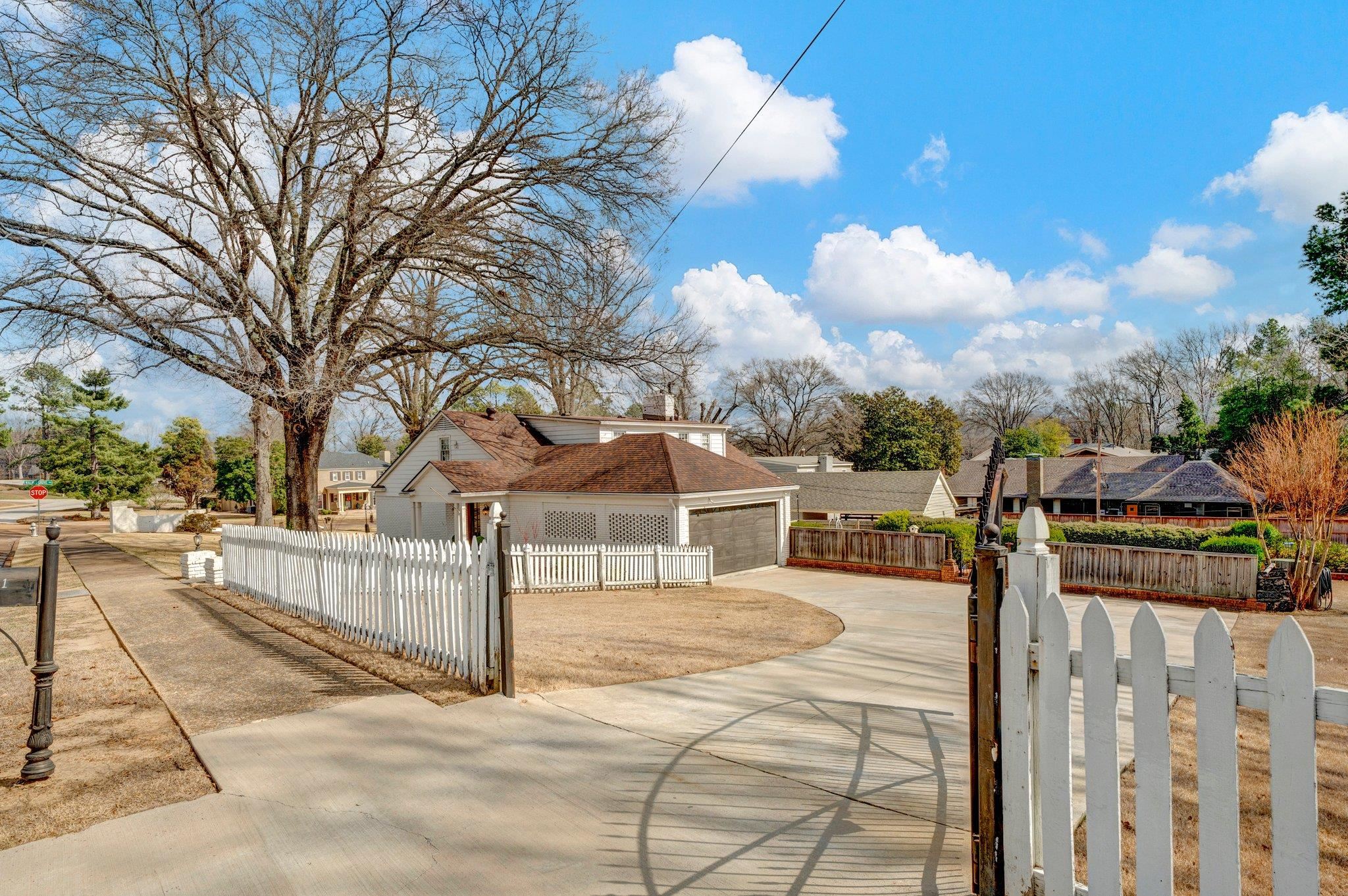 5481 Walnut Grove Road Memphis, TN 38120 - Photo 5 of 40 a view of a house with wooden fence