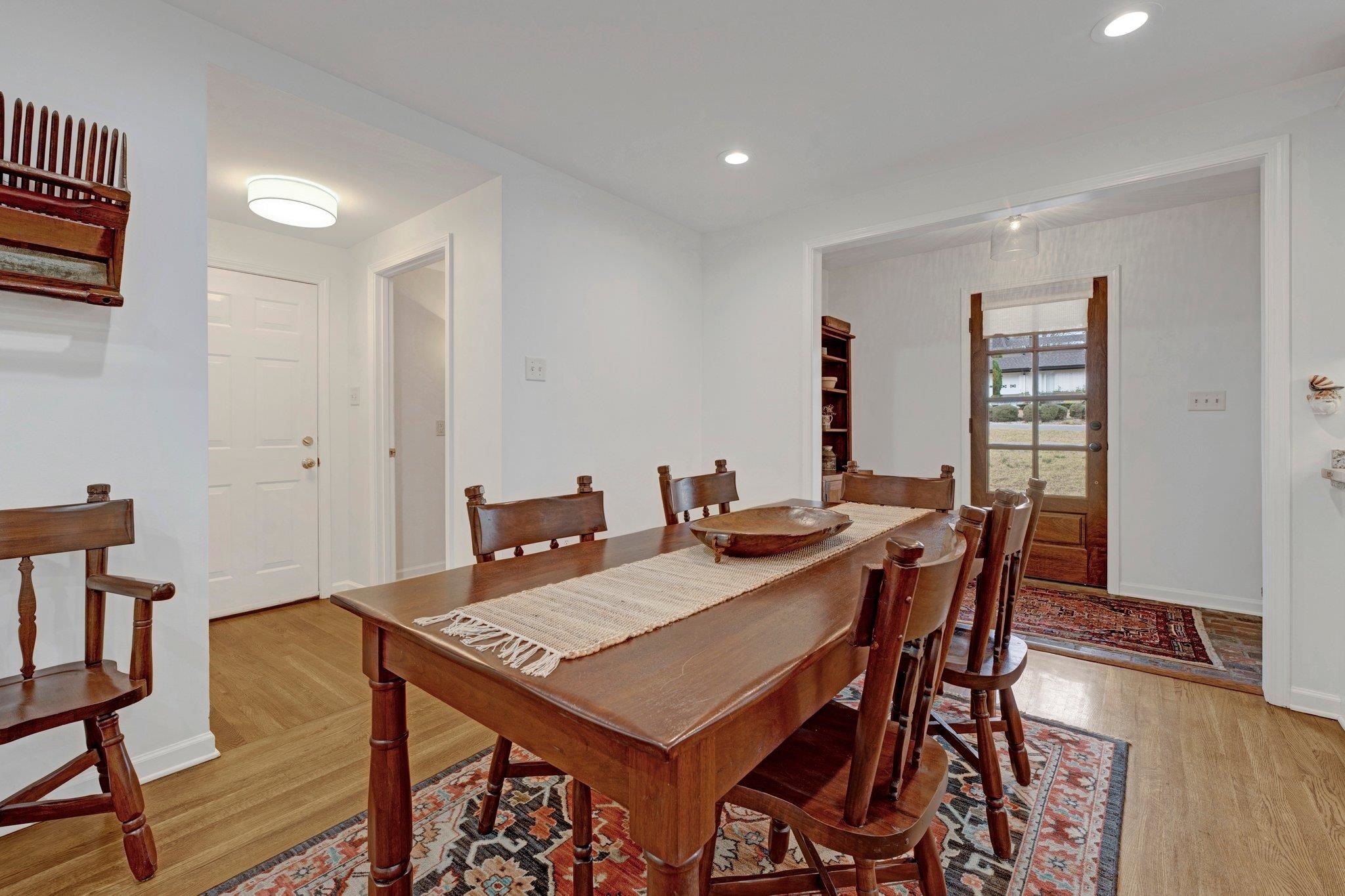 5481 Walnut Grove Road Memphis, TN 38120 - Photo 8 of 40 a view of a dining room with furniture and wooden floor