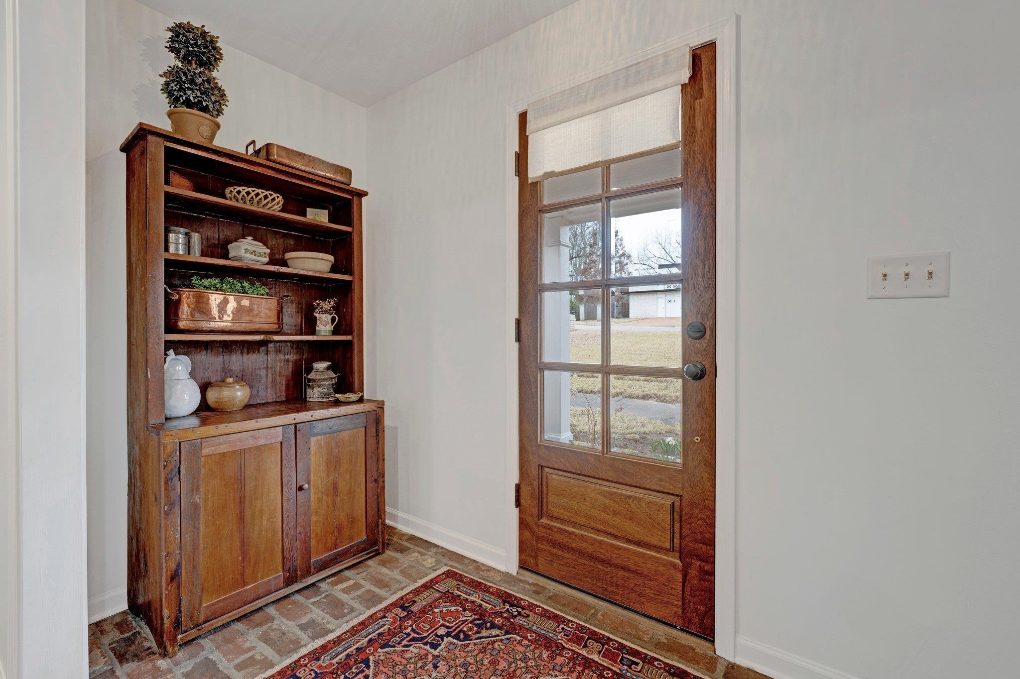 5481 Walnut Grove Road Memphis, TN 38120 - Photo 10 of 40 a view of room with cabinets and a window