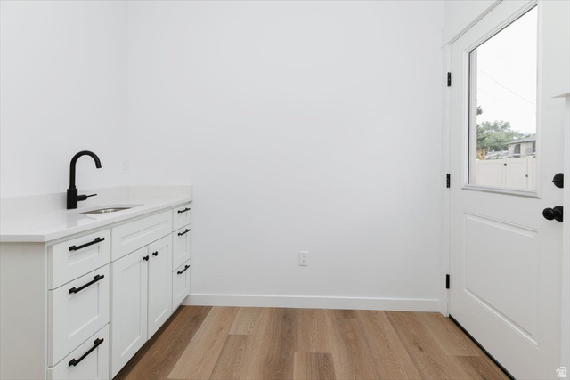314 North 200 West Logan, UT 84321 - Photo 12 of 37 Laundry room featuring light wood-style flooring and a sink