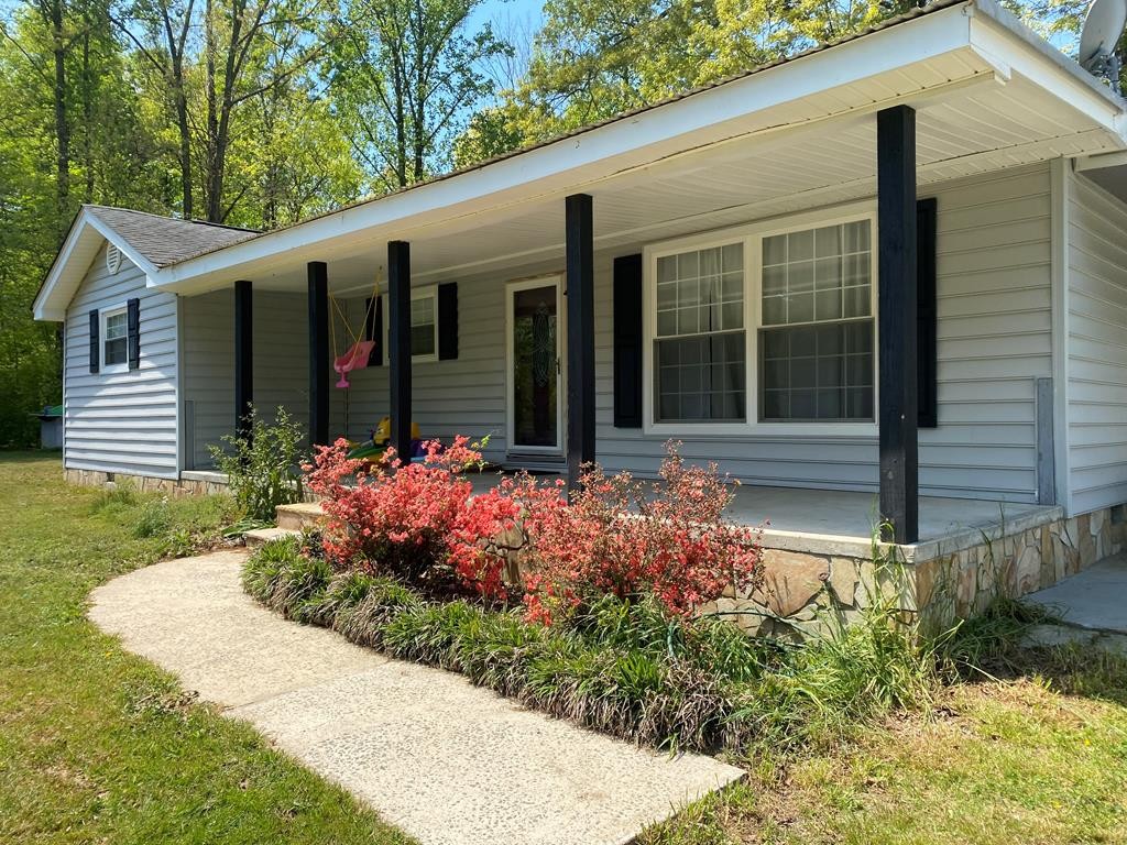 410 Curtis Road Cleveland, TN 37323 - Photo 1 of 23 a front view of a house with garden