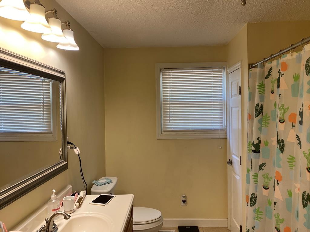 410 Curtis Road Cleveland, TN 37323 - Photo 13 of 23 a bathroom with a sink and a mirror