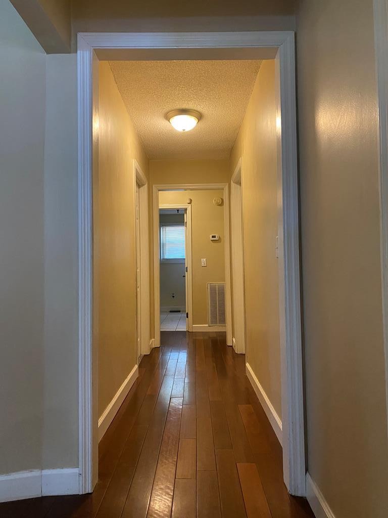 410 Curtis Road Cleveland, TN 37323 - Photo 8 of 23 a view of a hallway with wooden floor