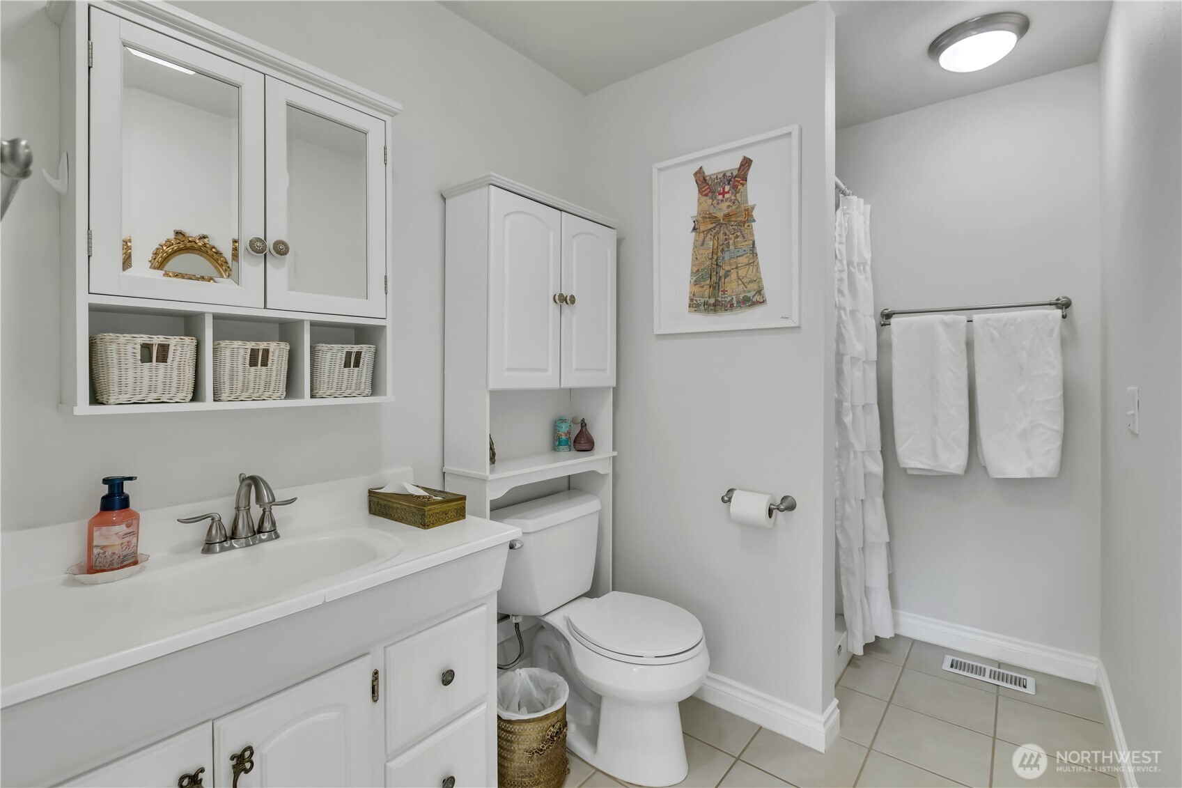 131 South 324th Place Federal Way, WA 98003 - Photo 14 of 24 a bathroom with a sink a toilet and shower