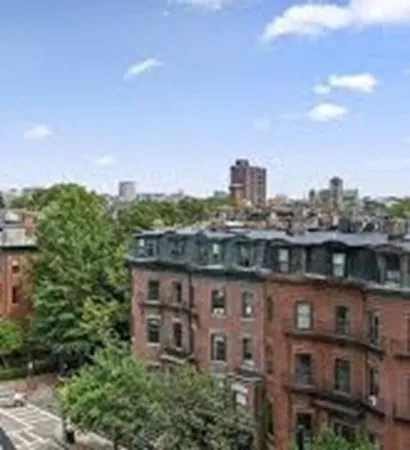 a view of a city with tall buildings