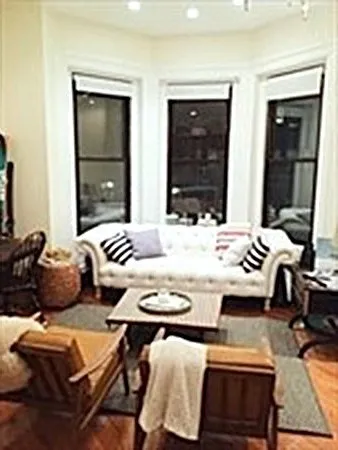 a living room with furniture and a table