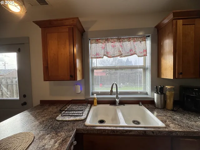 a view of a kitchen counter top space and a window