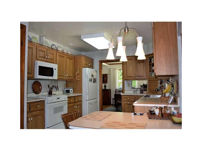 426 Sangree Road Pittsburgh, PA 15237 - Photo 11 of 25 Kitchen. The electric stove, dishwasher and refrigerator are newer appliances. There is also a laundry chute in the kitchen.