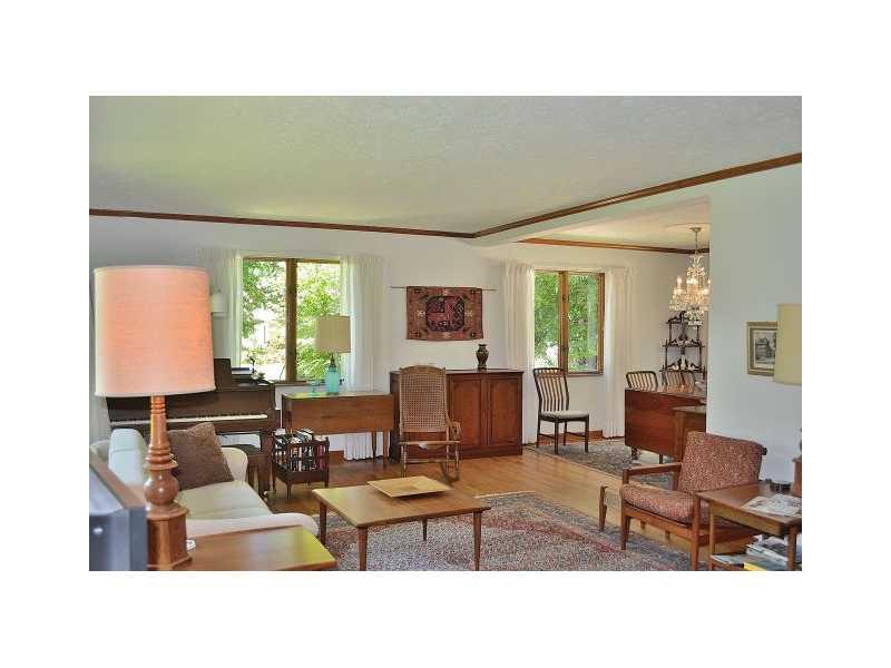 426 Sangree Road Pittsburgh, PA 15237 - Photo 4 of 25 Living Room. The house has hardwood floors throughout, though some are covered with wall-to-wall carpeting. The large windows fill the house with light! The living room is open to the dining room, making it nice for large group dinners.